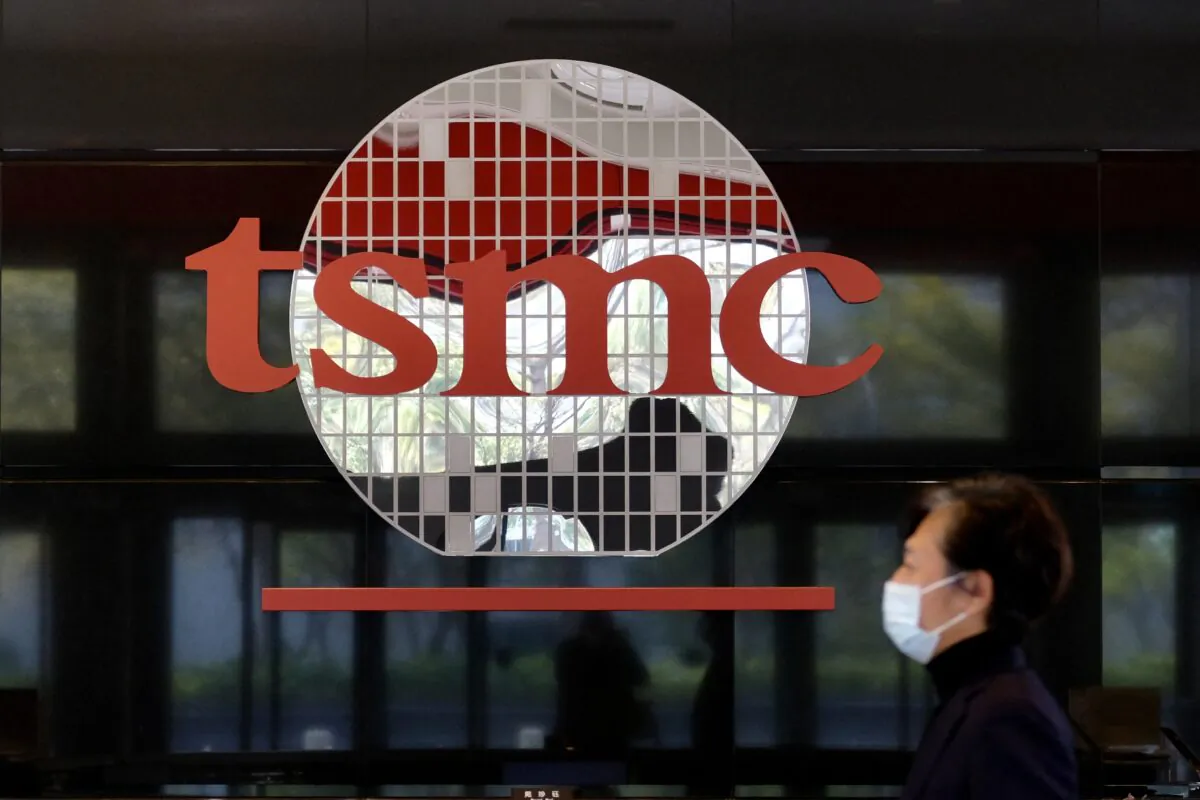 A man walks past a company logo at the headquarters of the world's largest semiconductor maker TSMC in Hsinchu on January 29, 2021. (SAM YEH/AFP via Getty Images)