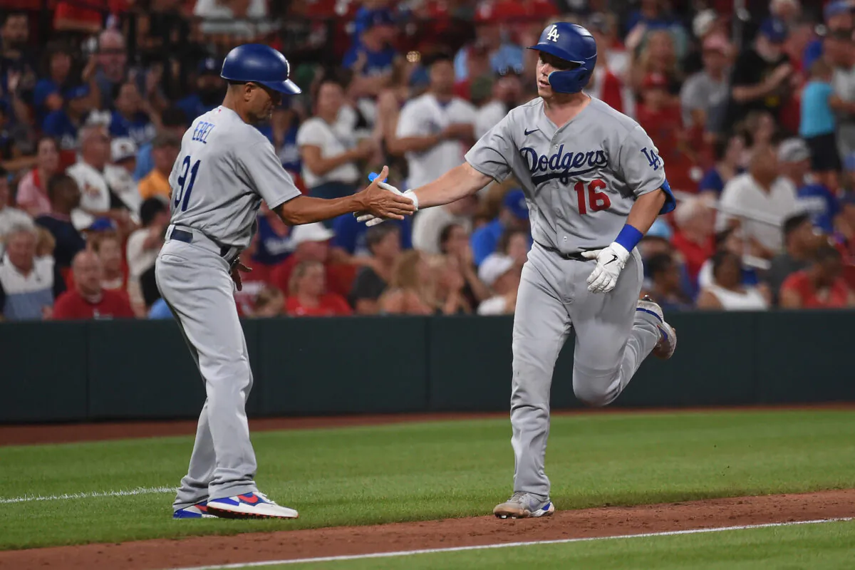 Will Smith #16 of the Los Angeles Dodgers celebrates his two-run home run with third base coach Dino Ebel #91 against the St. Louis Cardinals in the seventh inning at Busch Stadium, in St Louis, on July 13, 2022. (Joe Puetz/Getty Images)