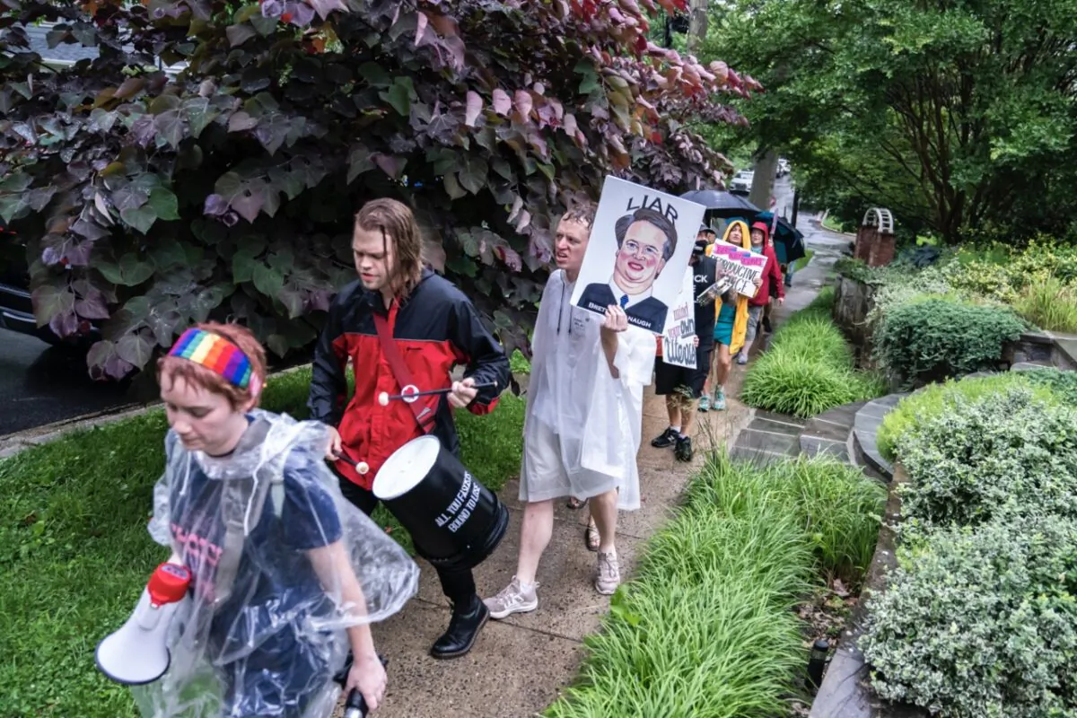 Protesters march past Supreme Court Justice Brett Kavanaugh's home in Chevy Chase, Maryland on June 8, 2022. (Nathan Howard/Getty Images)