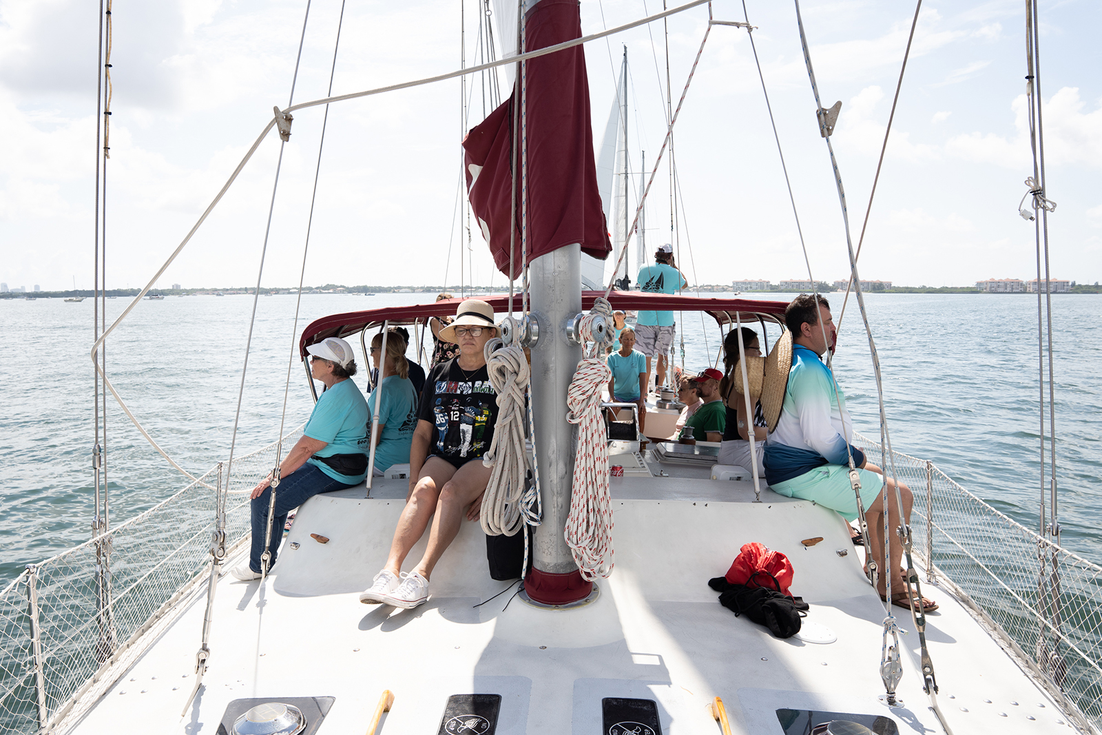 People onboard the Magic, the largest sailboat in the Soothe Our Souls fleet, do yoga