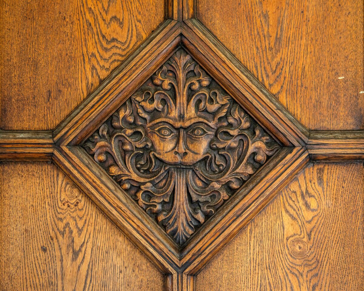 Oxford, UK - August 20th 2020: Lion-like carving in a door of Brasenose College in Oxford. It is said to have inspired CS Lewis to create The Lion, The Witch and the Wardrobe. (chrisdorney/Shutterstock)