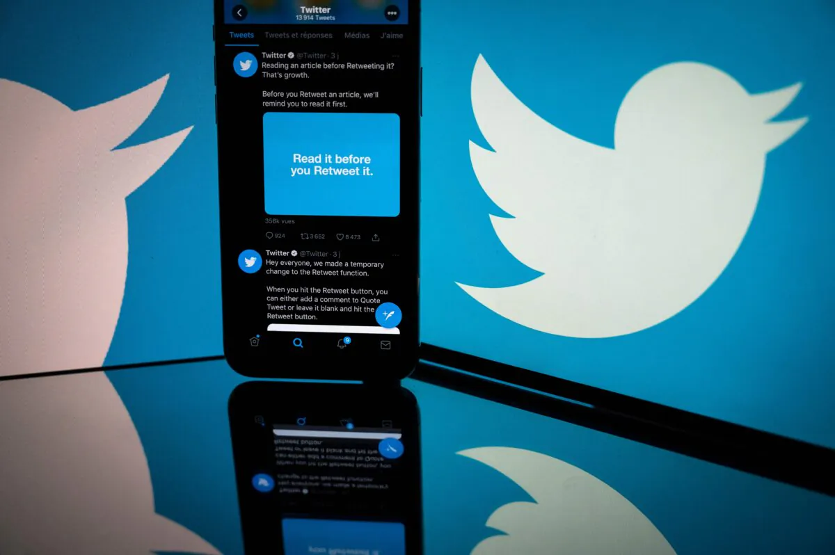 Logo of Twitter displayed on the screen of a smartphone and a tablet in Toulouse, southern France, on Oct. 26, 2020. (Lionel Bonaventure/AFP via Getty Images)