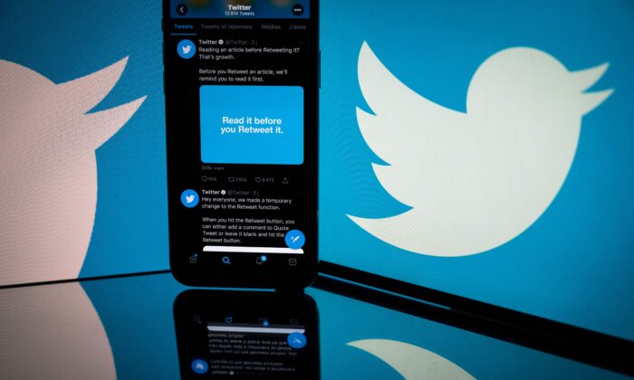 Logo of Twitter displayed on the screen of a smartphone and a tablet in Toulouse, southern France, on Oct. 26, 2020. (Lionel Bonaventure/AFP via Getty Images)