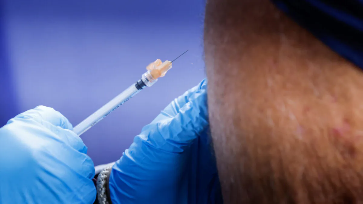Gary Sacks receives a monkeypox vaccination at the Northwell Health Immediate Care Center at Fire Island-Cherry Grove, in New York, on July 15, 2022. (Eduardo Munoz/Reuters)