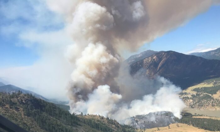 A wildfire blazing just west of Lytton, B.C., as shown in this handout image provided the BC Wildfire Service has now scorched five square kilometres of trees and bush, more than doubling in size in less than 12 hours. (The Canadian Press/HO-BC Wildfire Service)