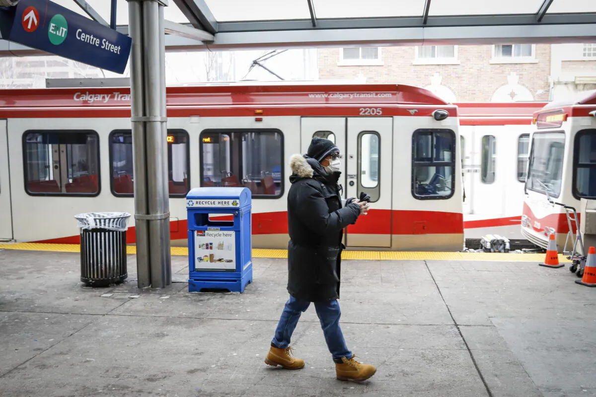 A man waits for transit in Calgary in a file photo. (The Canadian Press/Jeff McIntosh)