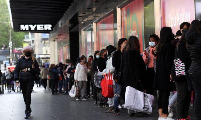 People queue outside a department store in Melbourne, Australia, on Oct. 29, 2021. (William West/AFP via Getty Images)