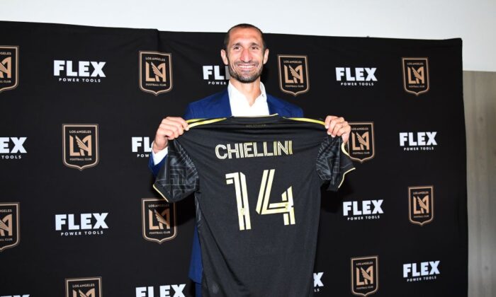 Defender Giorgio Chiellini poses with his jersey after he was introduced by Los Angeles Football Club during a news conference at Banc of California Stadium in Los Angeles on June 29, 2022. (Kevork Djansezian/Getty Images)