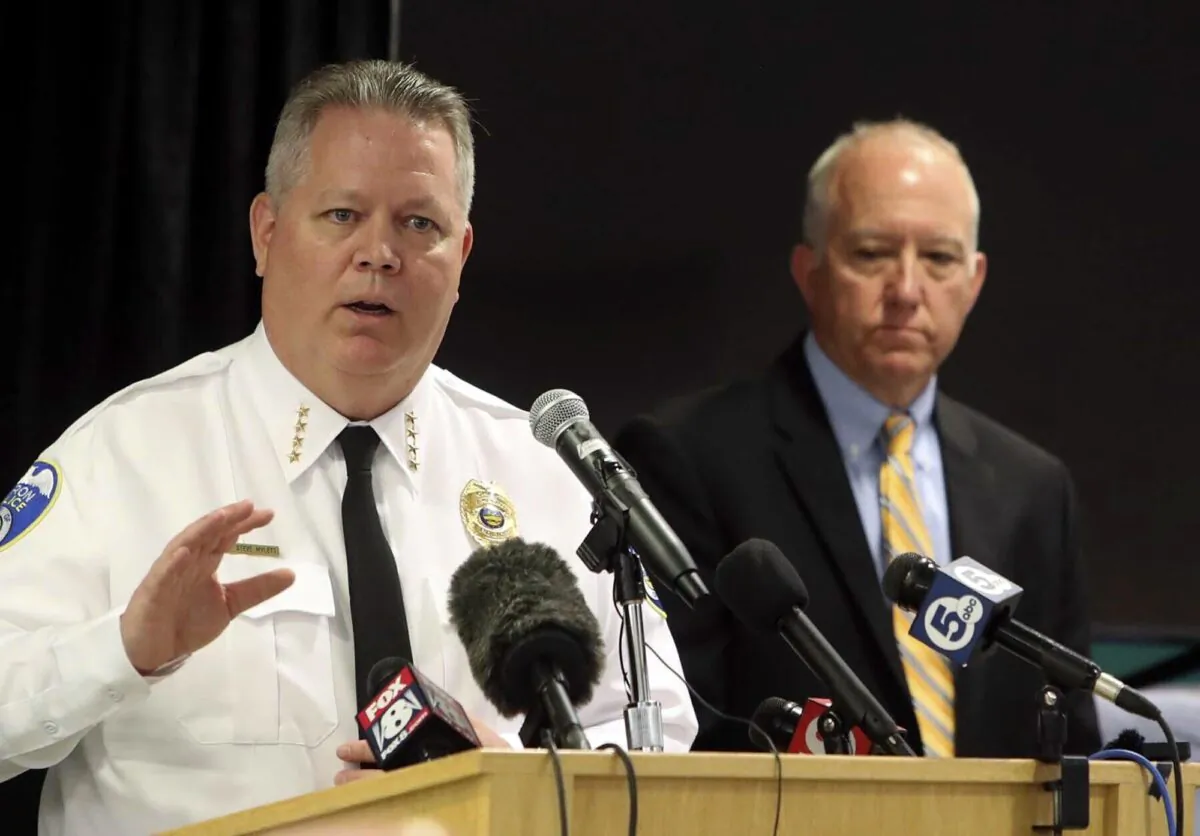 Akron Chief of Police Stephen L. Mylett, left, speaks during a news conference as he stands next to Akron Mayor Dan Horrigan at the Firestone Park Community Center in Akron, Ohio, on July 3, 2022. (Karen Schiely/Akron Beacon Journal via AP)