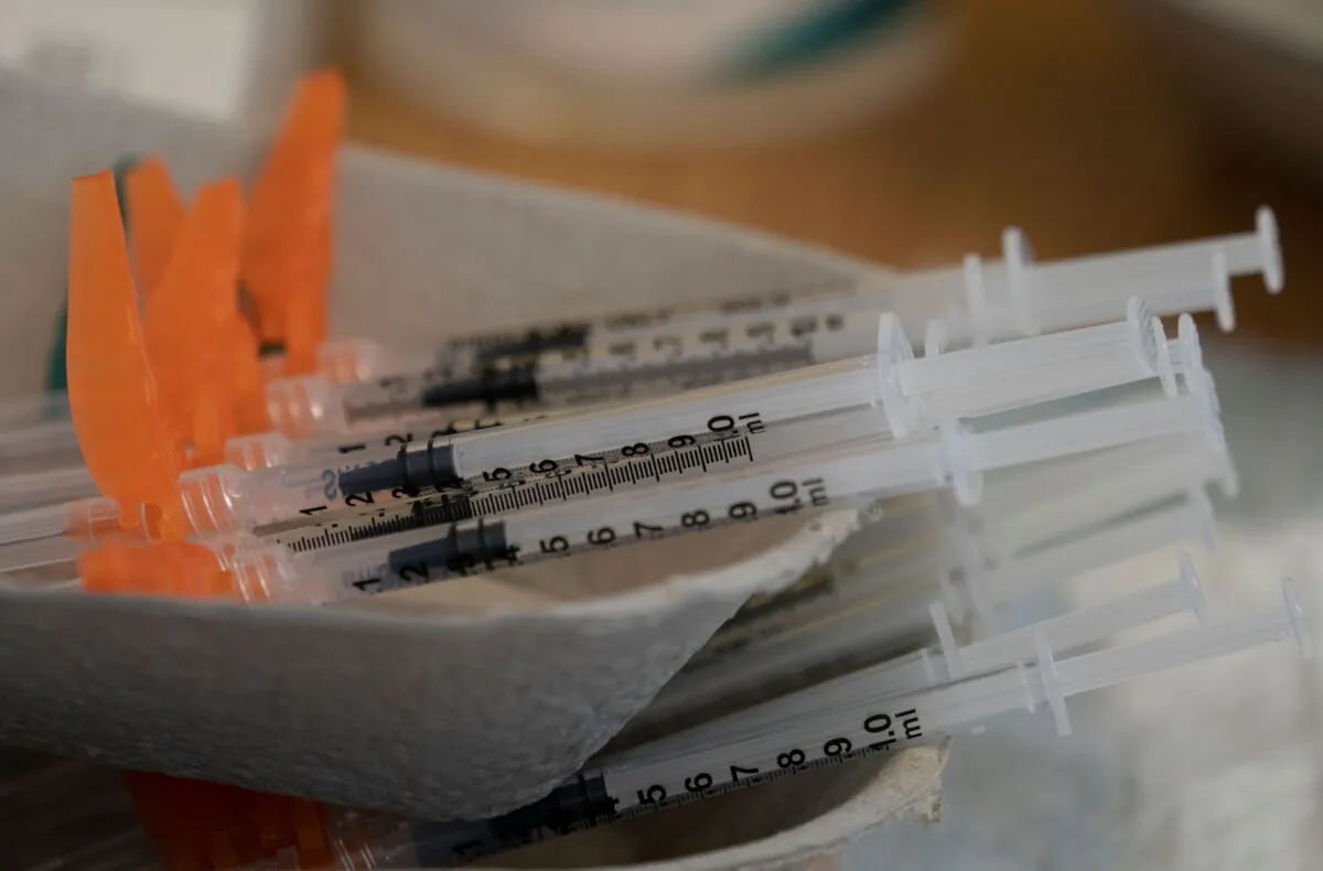 Needles are seen filled with COVID-19 vaccination at a truck stop along highway 91 North in Delta, B.C., on June 16, 2021. (The Canadian Press/Jonathan Hayward)