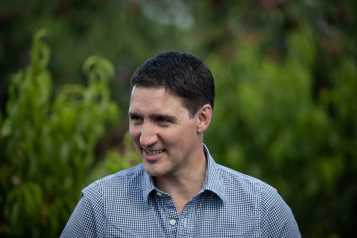 Prime Minister Justin Trudeau visits family farm owner Derek Lutz's orchard in Summerland, B.C., Monday, July 18, 2022. (Darryl Dyck/The Canadian Press)
