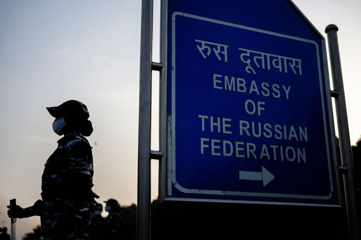 A policewoman stands guard near the Russian embassy in anticipation of a demonstration called to stop the Russian invasion of Ukraine in New Delhi on Feb. 25, 2022. (Jewel Samad/AFP via Getty Images)