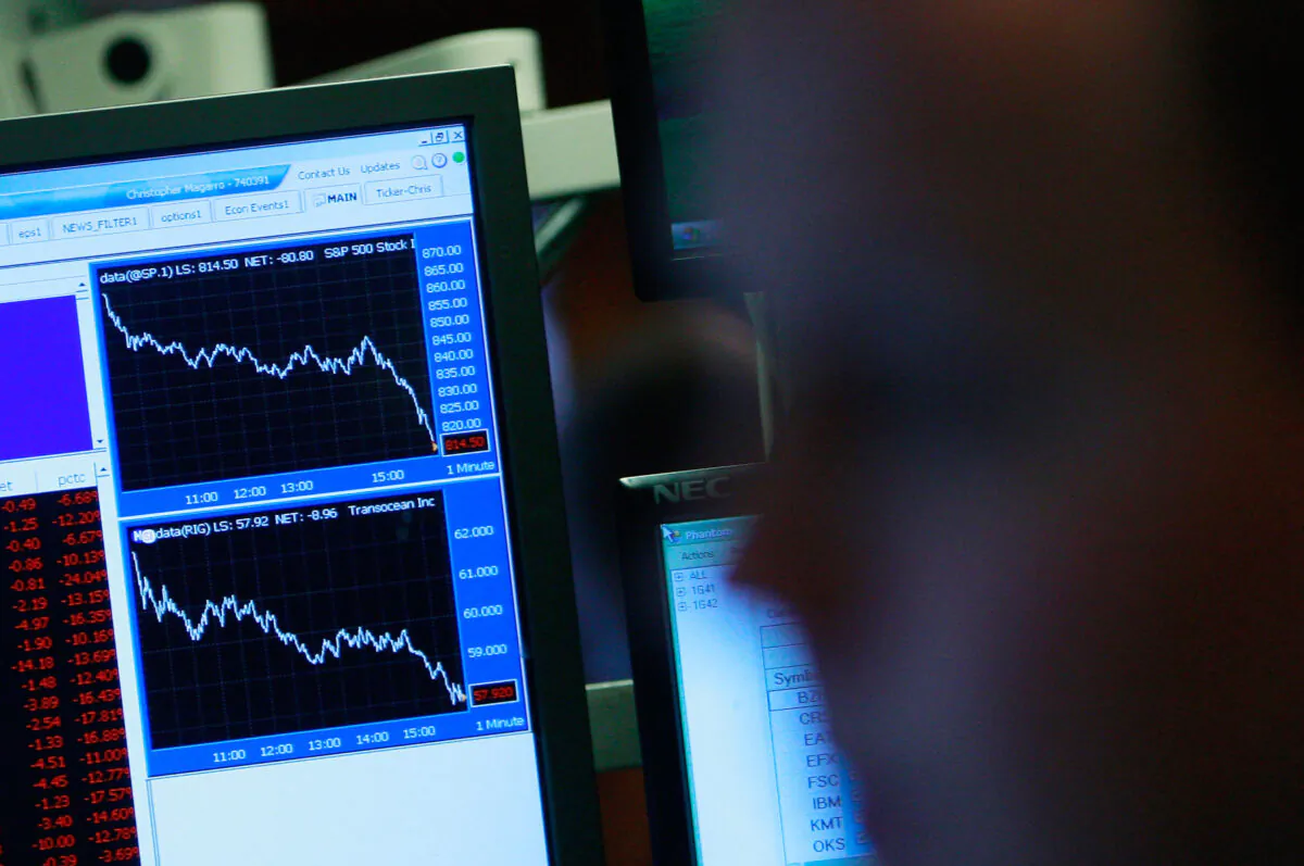 Traders work on the floor of the New York Stock Exchange moments before the closing bell, in New York City, on Dec. 1, 2008 in this file image. The Dow closed down nearly 680 points following negative economic reports. The National Bureau of Economic Research said today that the U.S. economy has been in a recession since December 2007. (Mario Tama/Getty Images)