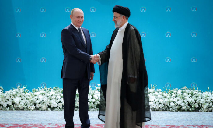 Russian President Vladimir Putin (L) and Iranian President Ebrahim Raisi meet before a summit of leaders from the guarantor states of the Astana process, designed to find a peace settlement in the Syrian conflict, in Tehran, Iran, on July 19, 2022. (President Website/WANA (West Asia News Agency)/Handout via Reuters)