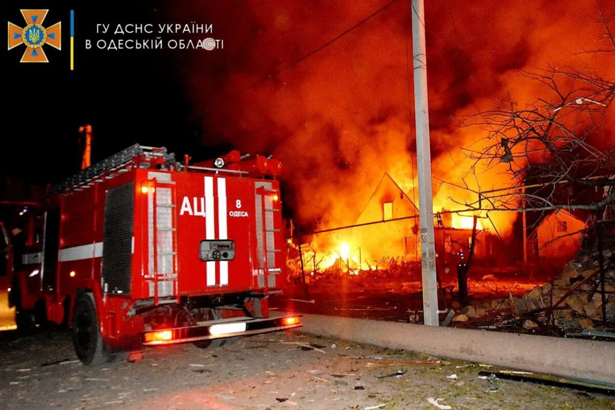 A general view shows a fire engine at a scene of a burning building after a strike in a location given as Odesa, Ukraine in this picture obtained from social media released on July 19, 2022. (State Emergency Service of Ukraine (DSNS)/Handout via Reuters)