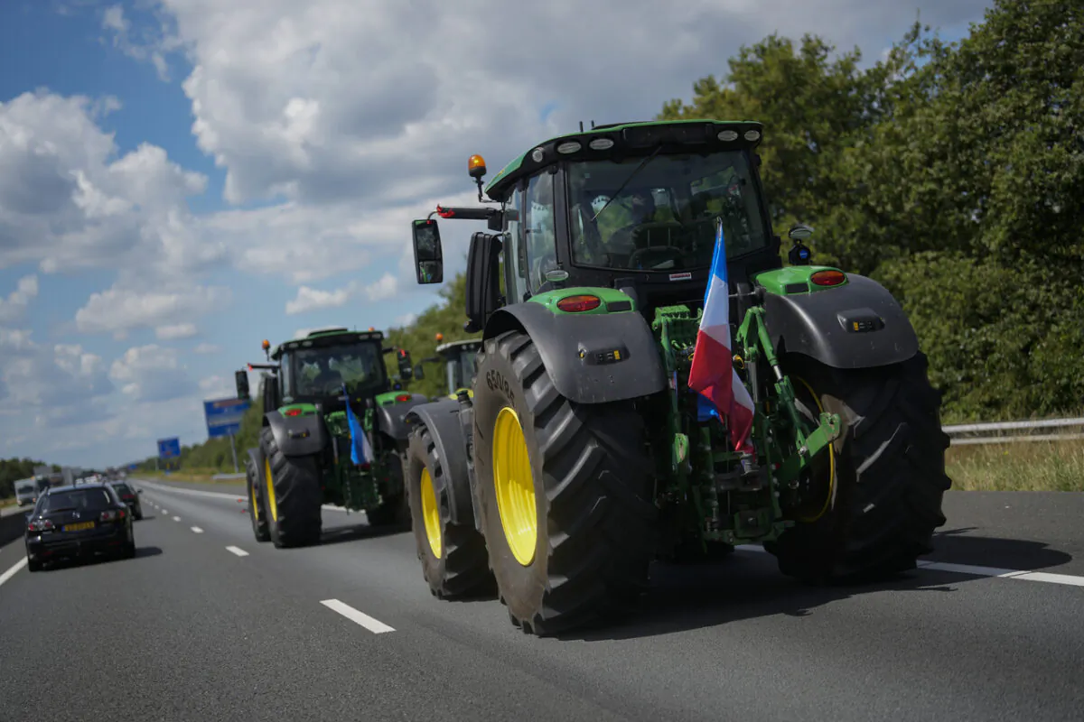 Demonstrating farmers slow down traffic on a motorway near Venlo, southern Netherlands, on July 4, 2022. Dutch farmers angry at government plans to slash emissions used tractors and trucks to blockade supermarket distribution centers, the latest actions in a summer of discontent in the country's lucrative agricultural sector. (Thibault Camus/AP Photo)
