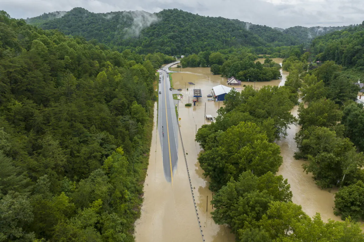 Buildings and roads are flooded near Lost Creek, Ky., on July 28, 2022. (Ryan C. Hermens/Lexington Herald-Leader via AP)