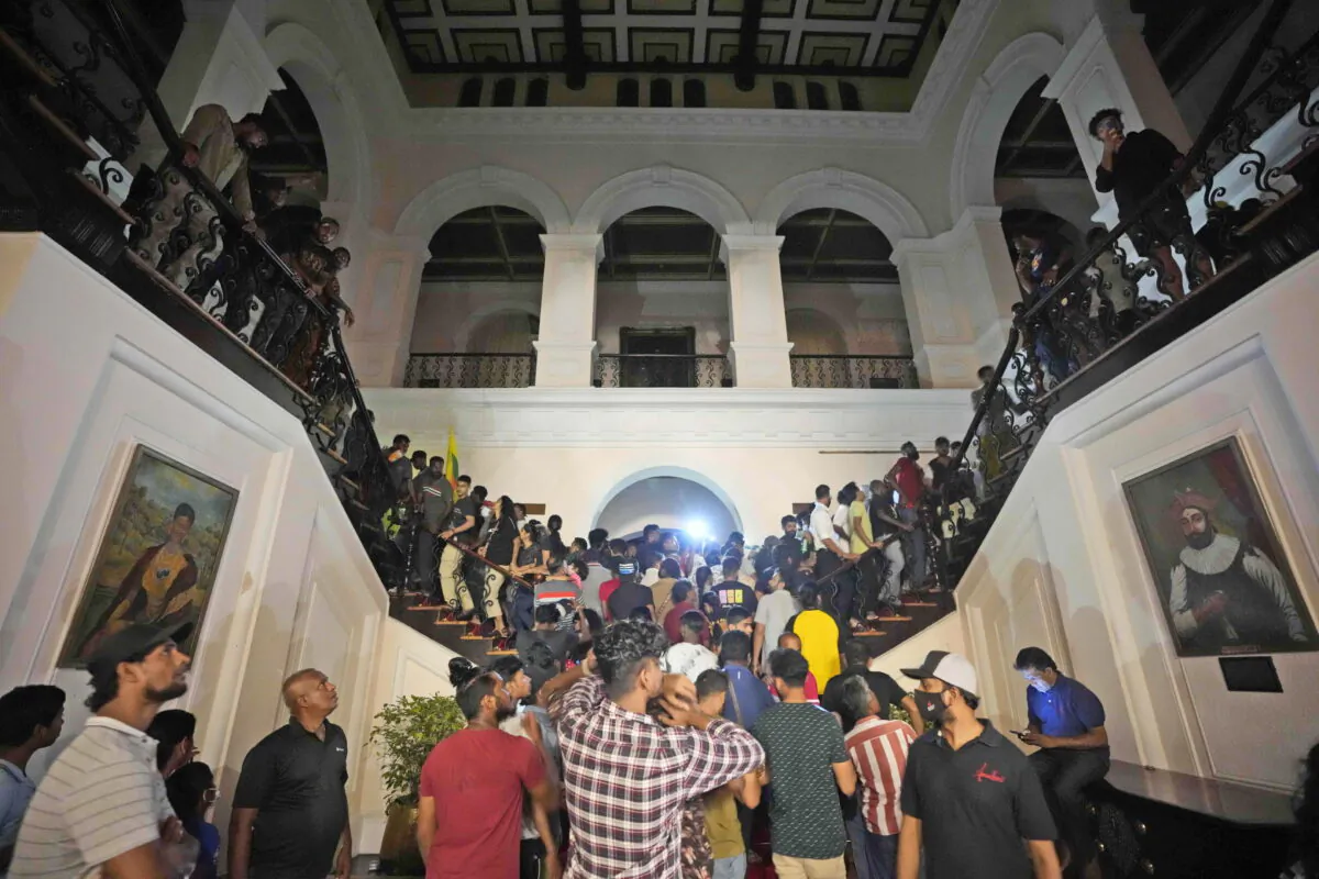 Protesters storm in at the Sri Lankan president's official residence, in Colombo, Sri Lanka, on July, 9, 2022. (Eranga Jayawardena/AP Photo)