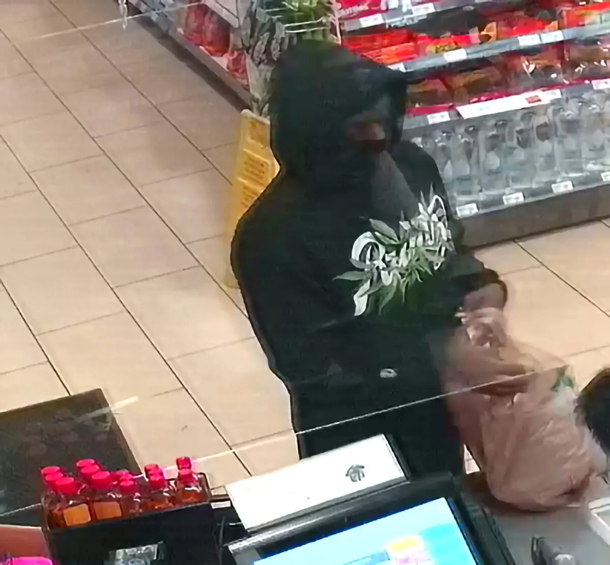 A person that police are attempting to identify in connection with two people who were killed and three who were wounded in shootings at four 7-Eleven locations in Southern California on July 11, 2022. (Upland Police Department via AP)