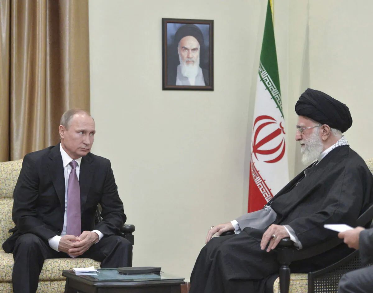 Russia's President Vladimir Putin (L), who arrived to attend the Gas Exporting Countries Forum (GECF), meets with Iran's Supreme Leader Ayatollah Ali Khamenei in Tehran, Iran, Nov. 23, 2015. (REUTERS/Alexei Druzhinin/Sputnik/Kremlin/File Photo}