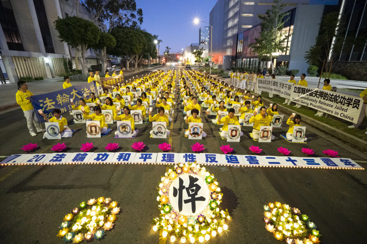 Falun Gong adherents hold a candlelight vigil in front of the Chinese Consulate to mark the 23 years of persecution by the Chinese Communist Party in Los Angeles on July 18, 2022. (Debora Cheng/The Epoch Times)