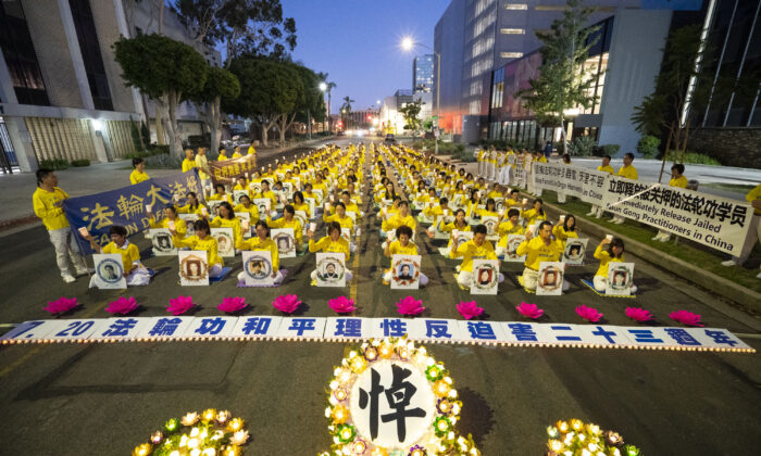Falun Gong adherents hold a candlelight vigil in front of the Chinese Consulate to mark the 23 years of persecution by the Chinese Communist Party in Los Angeles on July 18, 2022. (Debora Cheng/The Epoch Times)
