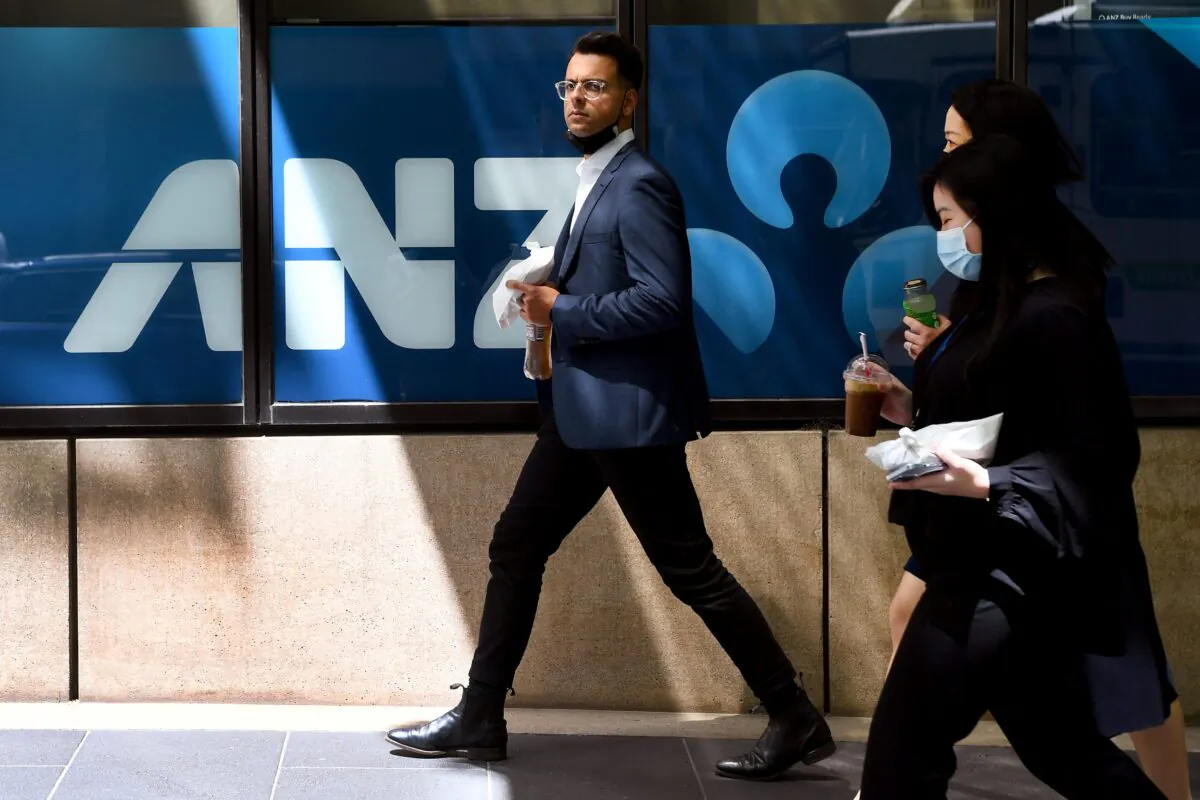 People walk past an ANZ Bank in Melbourne, Australia, on Oct. 28, 2021. (William West/ Getty Images)