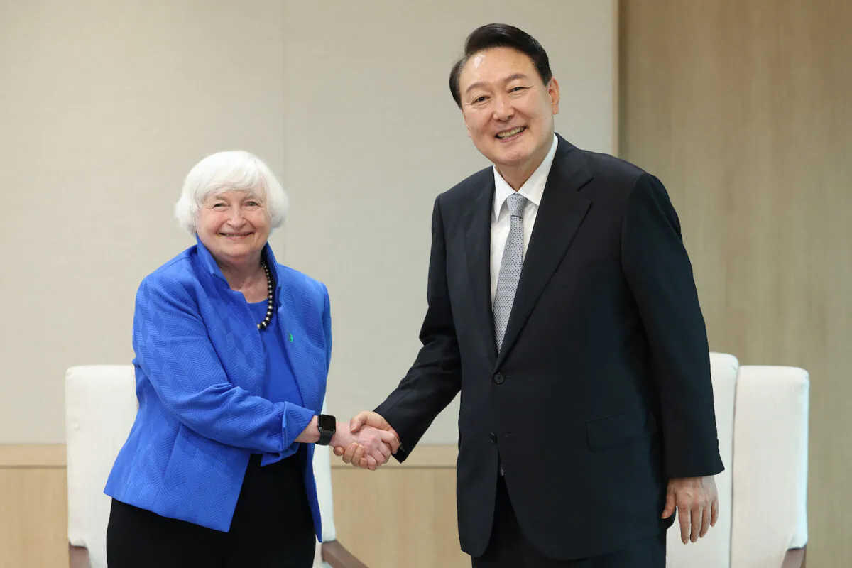 South Korean President Yoon Suk-yeol (R) shakes hands with U.S. Treasury Secretary Janet Yellen (L) during a meeting at the presidential office in Seoul, South Korea on July 19, 2022. (South Korean Presidential Office via Getty Images)