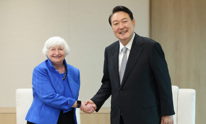South Korean President Yoon Suk-yeol (R) shakes hands with U.S. Treasury Secretary Janet Yellen (L) during a meeting at the presidential office in Seoul, South Korea on July 19, 2022. (South Korean Presidential Office via Getty Images)