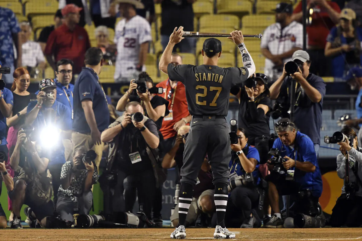 Giancarlo Stanton #27 of the New York Yankees holds up the Ted Williams MVP Award after the American League defeated the National League 3-2 during the 92nd MLB All-Star Game at Dodger Stadium in Los Angeles on July 19, 2022, (Kevork Djansezian/Getty Images)