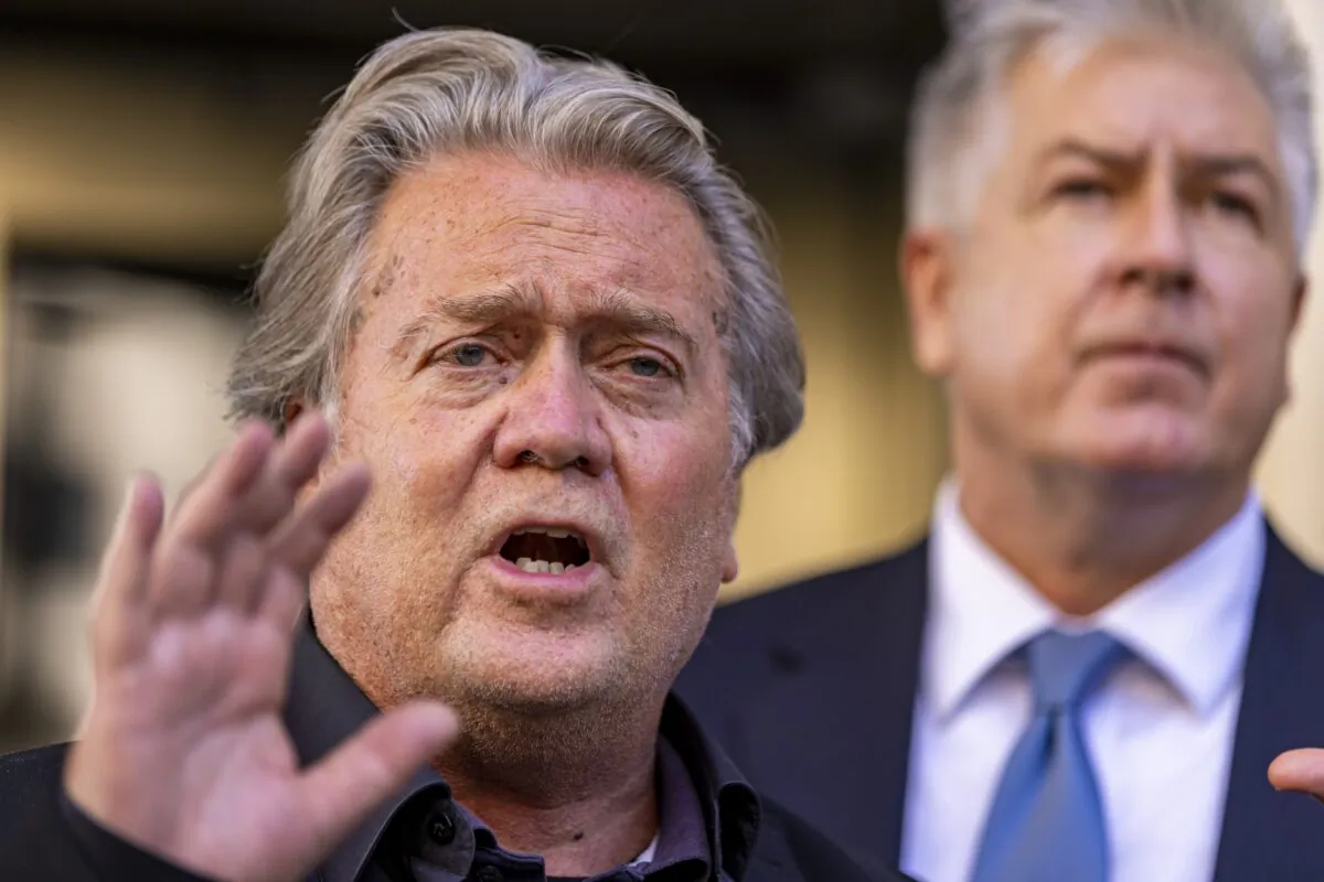 Former White House Chief Strategist Steve Bannon speaks to the media as his lawyer Matthew Evan Corcoran looks on after his trial for contempt of Congress began at the U.S. District Courthouse in Washington on July 19, 2022. (Tasos Katopodis/Getty Images)