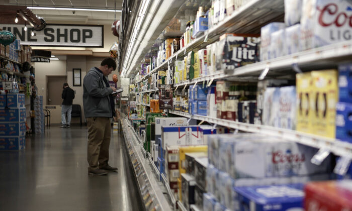 An employee surveys inventory in a Giant Food supermarket in Washington on Nov. 22, 2021. (Anna Moneymaker/Getty Images)