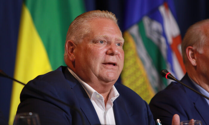 Premier Doug Ford responds to a question from the media on the final day of the summer meeting of the Canada's Premiers at the Fairmont Empress in Victoria, B.C., on July 12, 2022. (The Canadian Press/Chad Hipolito)