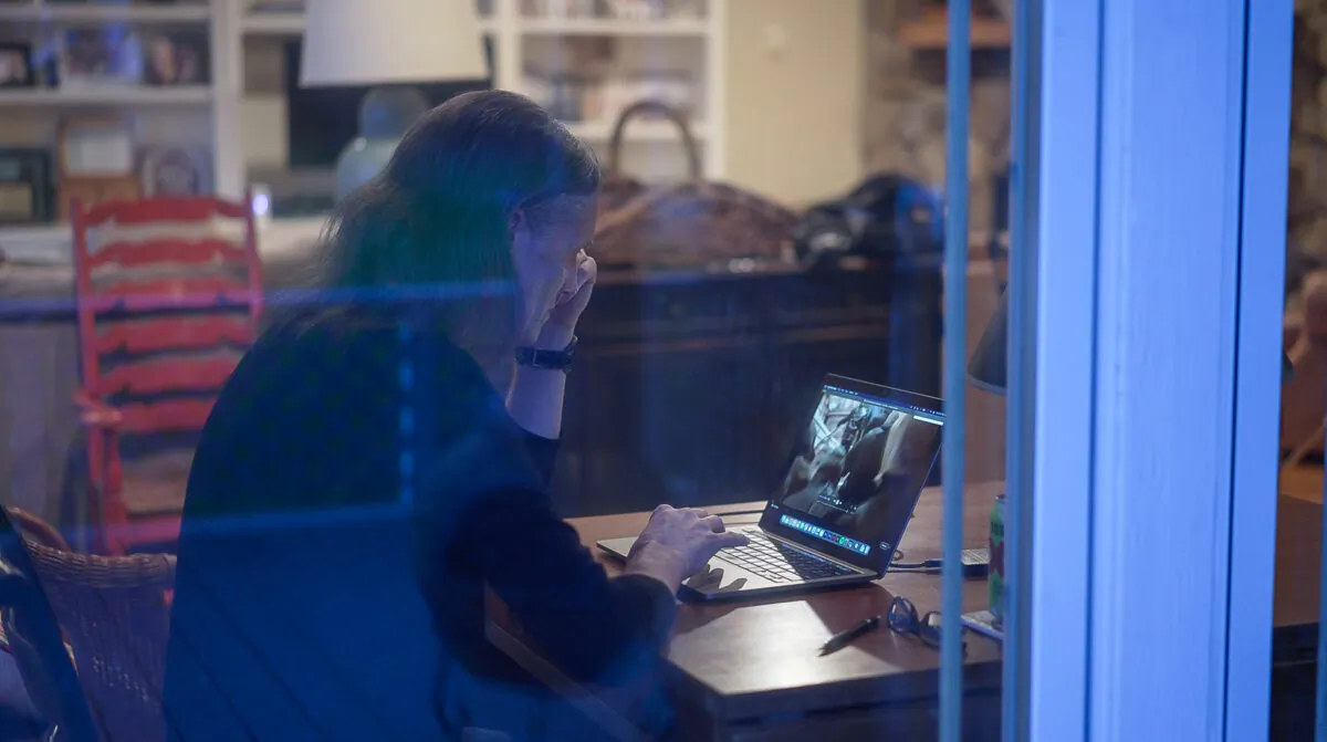 Gary McBride watches January 6 video frame by frame to find hidden clues, near Dallas on June 17, 2022. (Tal Atzmon/The Epoch Times)
