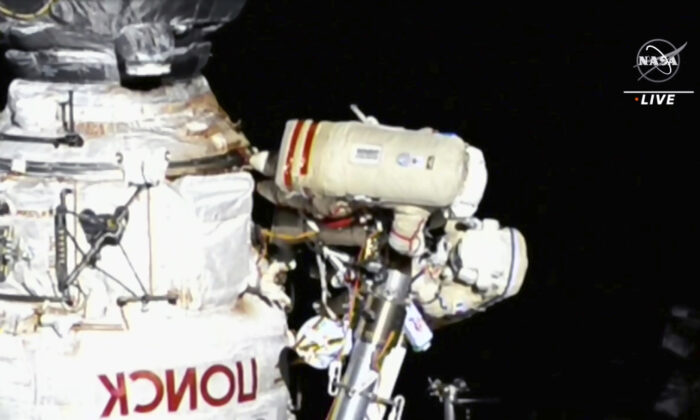 This image provided by NASA, Italian astronaut Samantha Cristoforetti and Russian cosmonaut Oleg Artemyev perform maintenance on the International Space Station on July 21, 2022. (NASA via AP).
