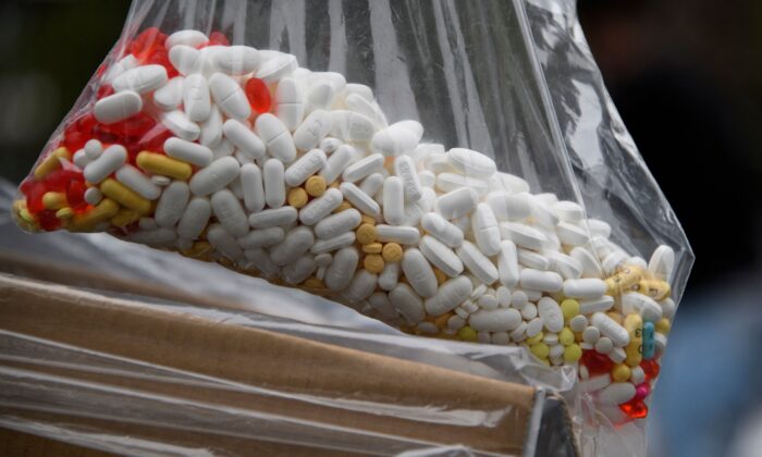 A bag of assorted pills and prescription drugs dropped off for disposal is displayed during the Drug Enforcement Administration (DEA) 20th National Prescription Drug Take Back Day at Watts Healthcare in Los Angeles, Calif., on April 24, 2021. (Patrick T. Fallon / AFP via Getty Images)