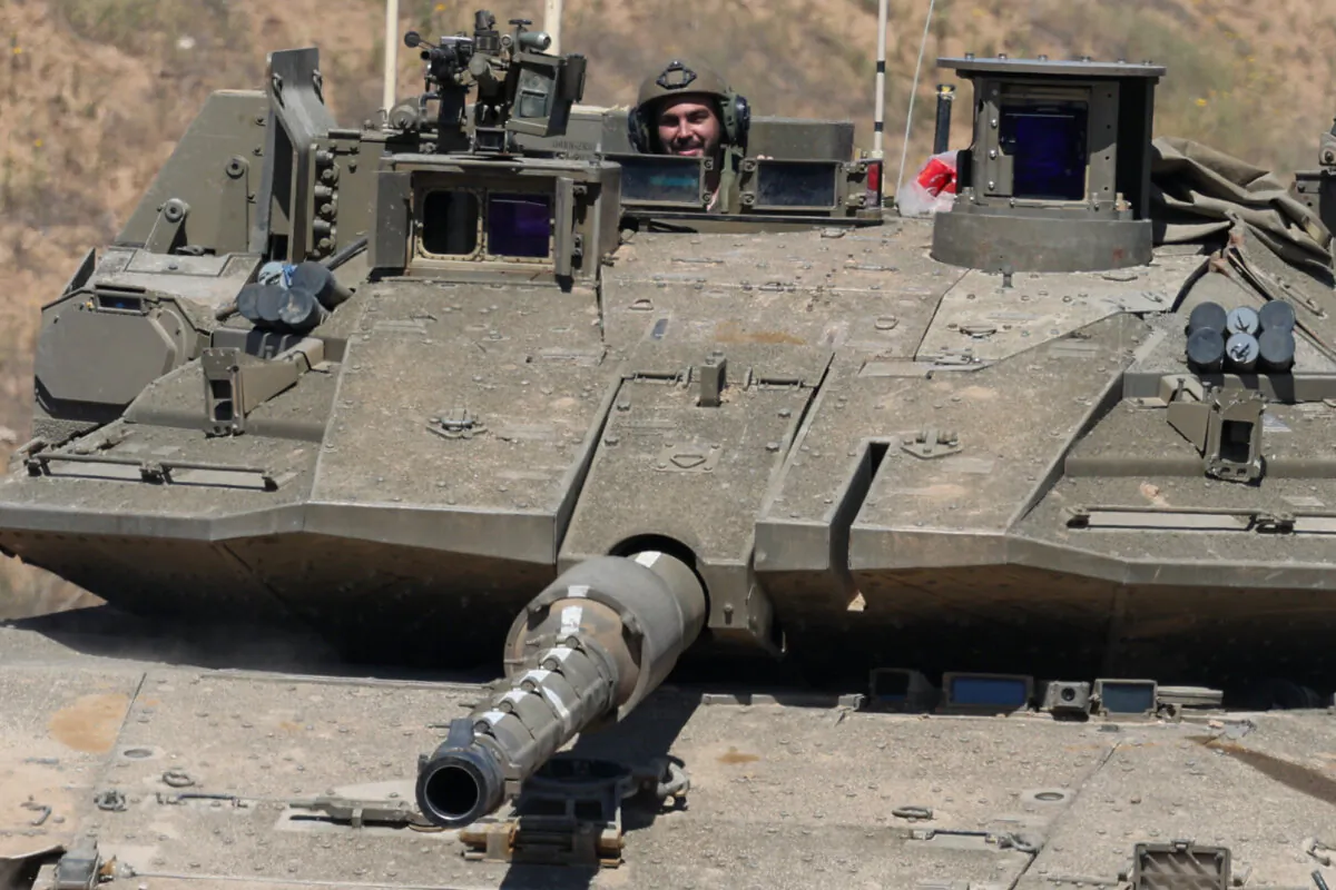 An Israeli soldier operates a tank at a position along Israel's southern border with the northern Gaza Strip on March 19, 2025. (Jack Guez/AFP via Getty Images)