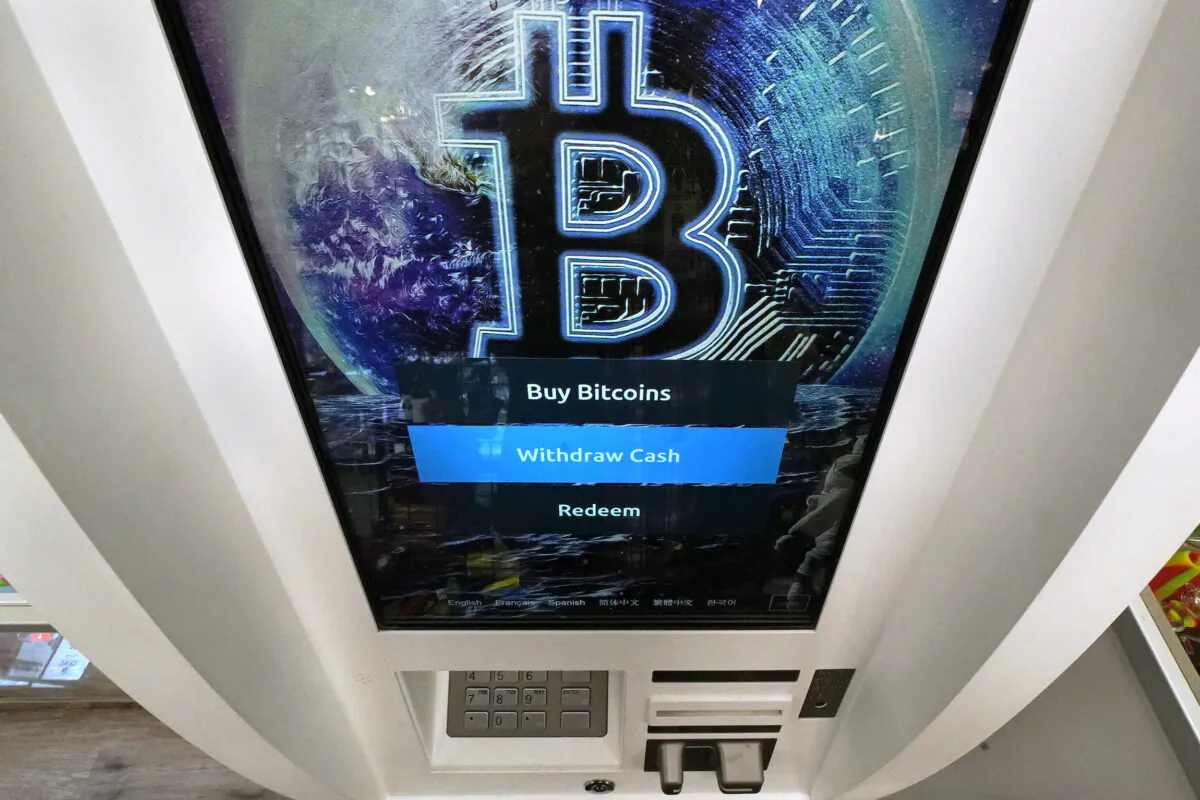 The Bitcoin logo appears on the display screen of a cryptocurrency ATM in Salem, N.H., on Feb. 9, 2021. (Charles Krupa/AP Photo)