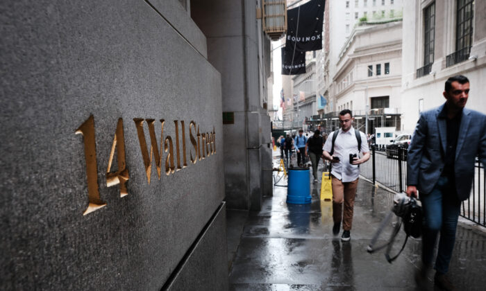 People walk by the New York Stock Exchange (NYSE) on June 14, 2022 in New York City. (Spencer Platt/Getty Images)