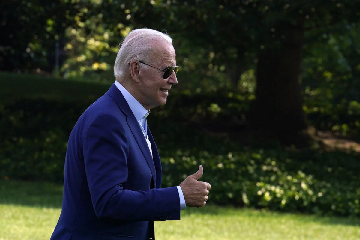 President Joe Biden offers a thumbs-up on the South Lawn of the White House upon his return to Washington from Somerset, Mass., on July 20, 2022. (Yuri Gripas/Abaca Press/TNS)