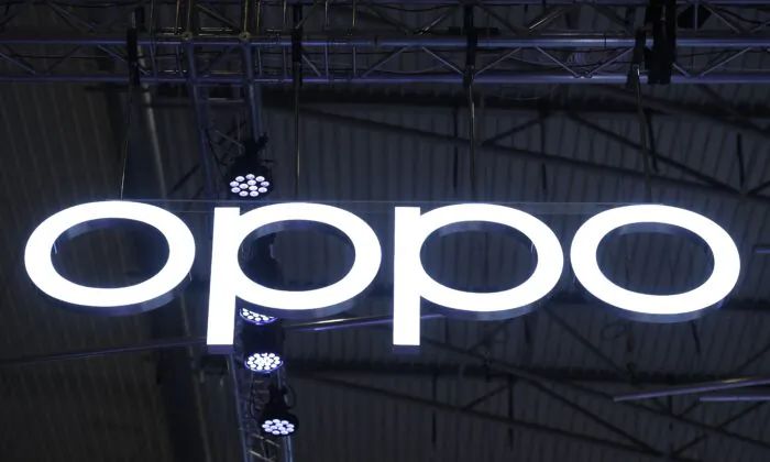 A OPPO logo is displayed at the MWC (Mobile World Congress) in Barcelona on March 2, 2022. (Photo by Josep Lago/AFP via Getty Images)