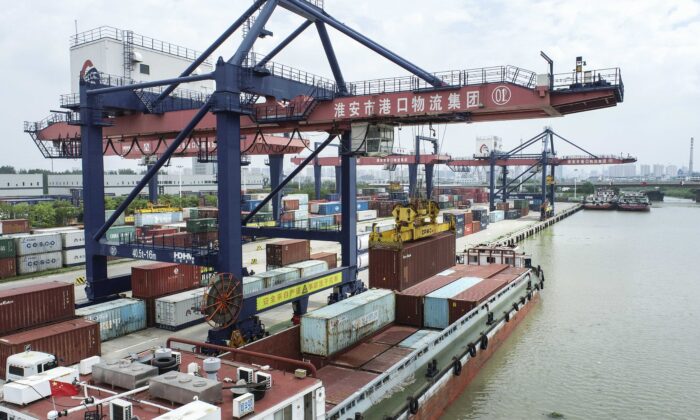 Container hoisting operations at Huai'an New Port in Huai'an, Jiangsu Province, China, on July 21, 2022. (CFOTO/Future Publishing via Getty Images)