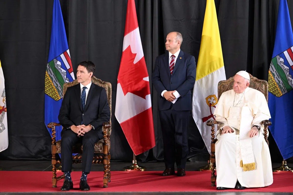 Pope Francis and Canadian Prime Minister Justin Trudeau take part in a welcoming ceremony for the Pope at Edmonton International Airport on July 24, 2022. (Patrick T. Fallon/AFP via Getty Images)