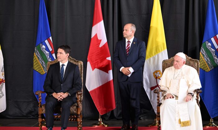 Pope Francis and Canadian Prime Minister Justin Trudeau take part in a welcoming ceremony for the Pope at Edmonton International Airport on July 24, 2022. (Patrick T. Fallon/AFP via Getty Images)