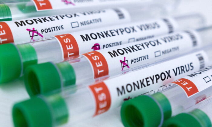 Test tubes labeled "Monkeypox virus, positive and negative" in a photo illustration taken on May 23, 2022. (Dado Ruvic/Reuters)