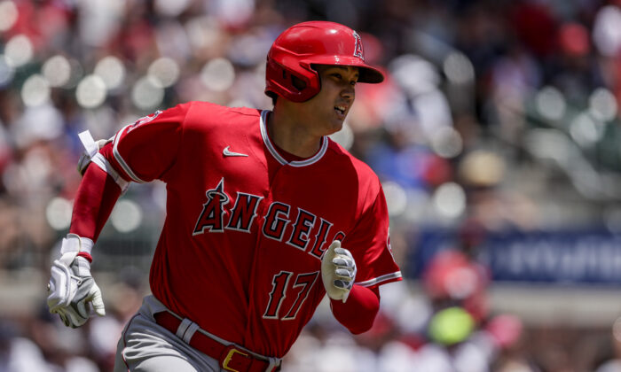 Los Angeles Angels' Shohei Ohtani runs toward first as he flies out during the first inning of a baseball game against the Atlanta Braves, in Atlanta, on Sunday, July 24, 2022. (Butch Dill/AP Photo)