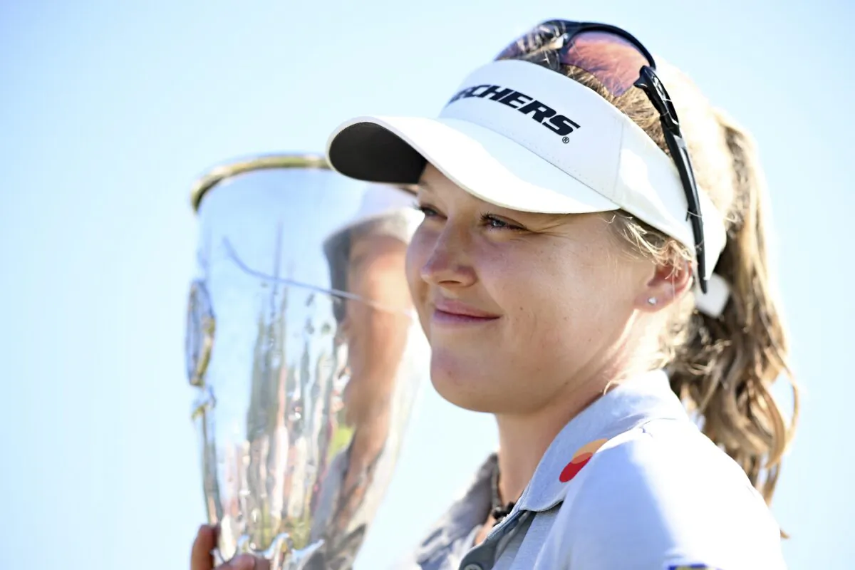 Brooke Henderson of Canada poses trophy after winning the The Amundi Evian Championship during day four of The Amundi Evian Championship at Evian Resort Golf Club in Evian-les-Bains, France, on July 24, 2022. (Stuart Franklin/Getty Images)