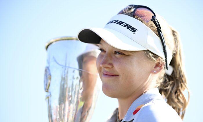 Brooke Henderson of Canada poses trophy after winning the The Amundi Evian Championship during day four of The Amundi Evian Championship at Evian Resort Golf Club in Evian-les-Bains, France, on July 24, 2022. (Stuart Franklin/Getty Images)