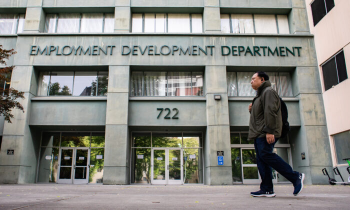 People walk past the California Employment Development Department (EDD) in Sacramento, Calif., on April 18, 2022. (John Fredricks/The Epoch Times)
