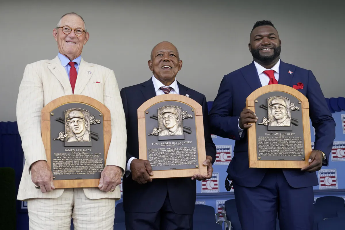 From left to right, National Baseball Hall of Fame inductees Jim Kaat, Tony Oliva and David Ortiz, hold their plaques during the Hall of Fame induction ceremony at the Clark Sports Center in Cooperstown, N.Y., on Sunday, July 24, 2022. (John Minchillo/AP Photo)